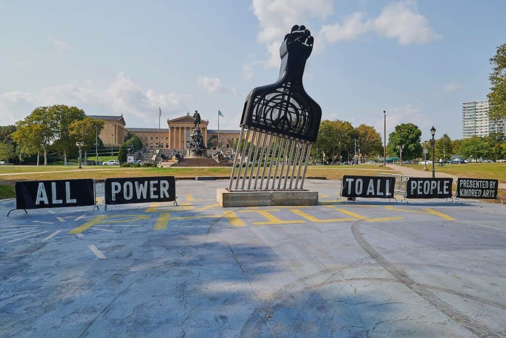All Power to All People, by Hank Willis Thomas Hank Willis Thomas's ''All Power to All People'' stands 28 feet tall and weighs 24,000lbs. It is installed in Eakins Oval as part of the Monumental Tour, made up of four large sculptures installed in celebrated public places