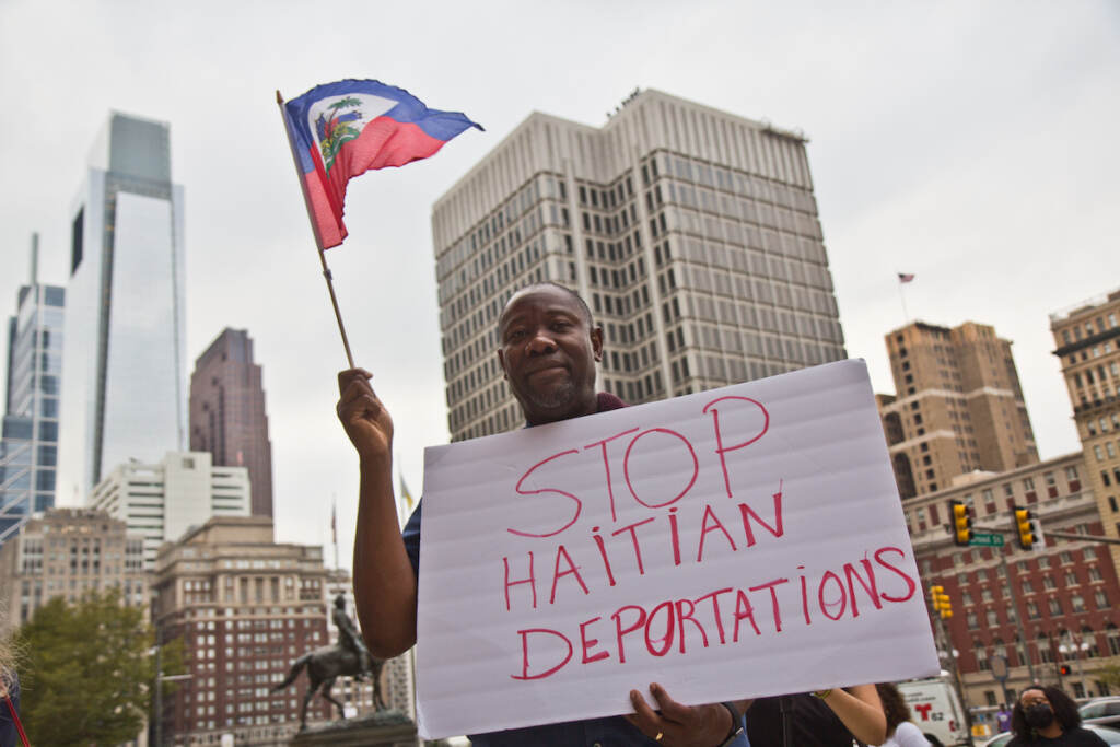 Joel Leon protested in solidarity with Haitians at the border and against the Biden administration’s deportation of Haitian asylum-seekers at City Hall in Philadelphia