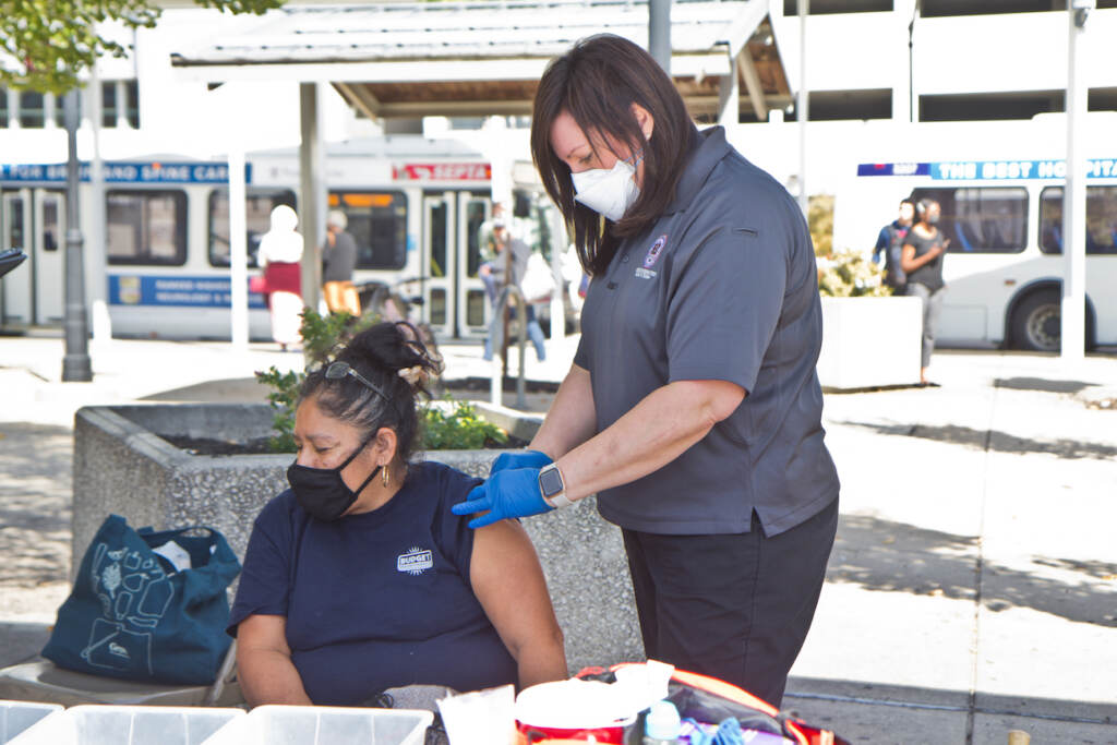 2021 09 29 k paynter governor wolf at norristown transpo-3 A woman receives the COVID-19 vaccine at Montgomery County Department of Safety’s mobile health vaccination site on September 29, 2021. (Kimberly Paynter/WHYY)