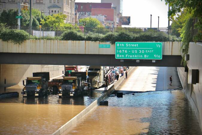 Flooding closes the Vine Street Expressway from Broad Street to the Schuylkill River.