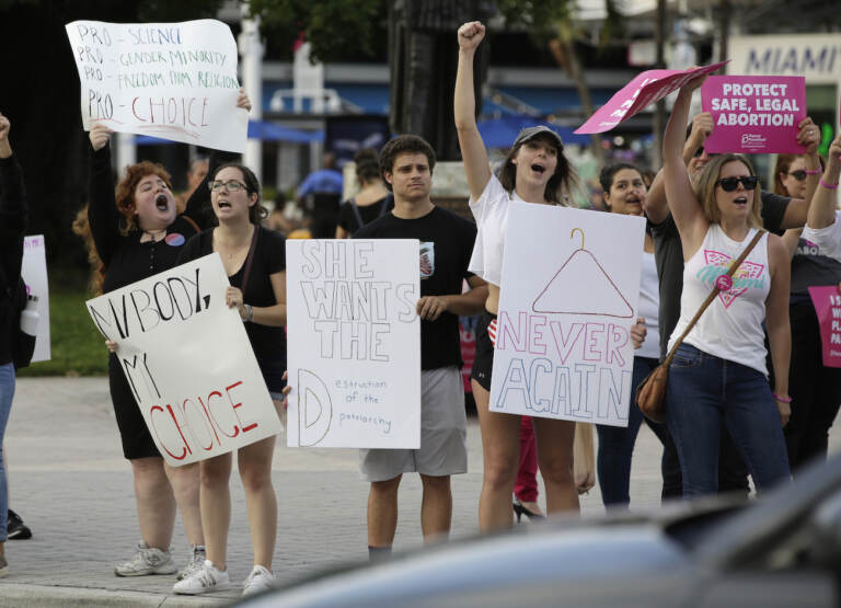 Demonstrators chant slogans during a rally