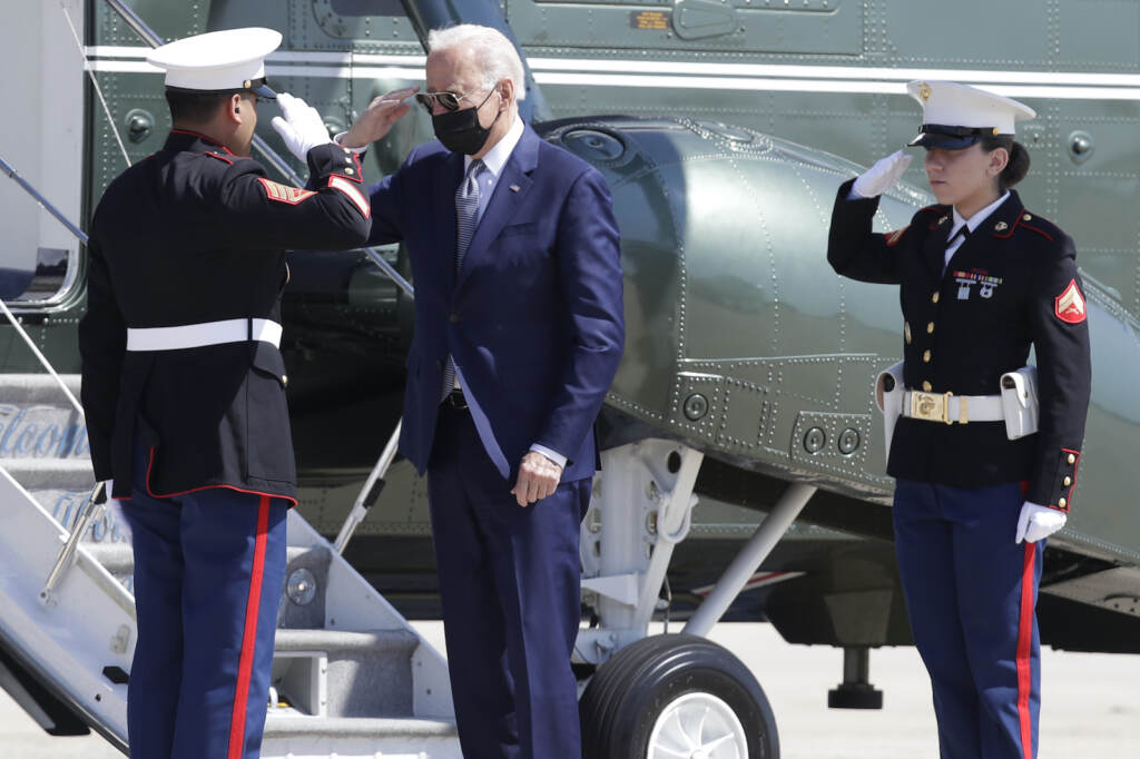Biden President Joe Biden returns a salute with a Marine Corp honor guard as he disembarks Marine One before boarding Air Force One