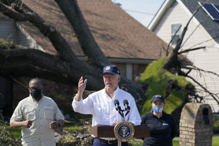President Joe Biden talks as he tours a neighborhood impacted by Hurricane Ida, Friday, Sept. 3, 2021, in LaPlace, La.