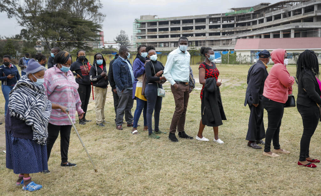 Virus Outbreak Kenyans queue up to receive the AstraZeneca coronavirus vaccine, at Kenyatta National Hospital in Nairobi, Kenya Thursday, Aug. 26, 2021