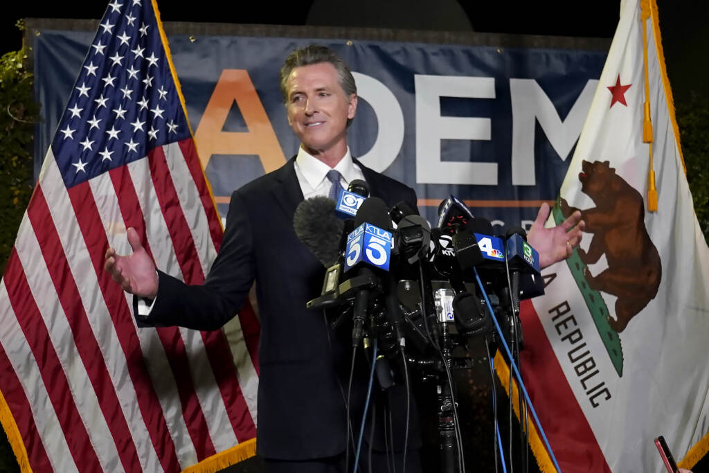 Gavin Newsom California Gov. Gavin Newsom addresses reporters after beating back the recall attempt that aimed to remove him from office, at the John L. Burton California Democratic Party headquarters in Sacramento, Calif., Tuesday, Sept. 14, 2021. (AP Photo/Rich Pedroncelli)