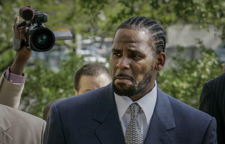 FILE - This photo from Friday May 9, 2008, shows R. Kelly arriving for the first day of jury selection in his child pornography trial at the Cook County Criminal Courthouse in Chicago. R. Kelly, the R&B superstar known for his anthem “I Believe I Can Fly,” was convicted Monday in a sex trafficking trial after decades of avoiding criminal responsibility for numerous allegations of misconduct with young women and children.  (AP Photo/Charles Rex Arbogast, File)
