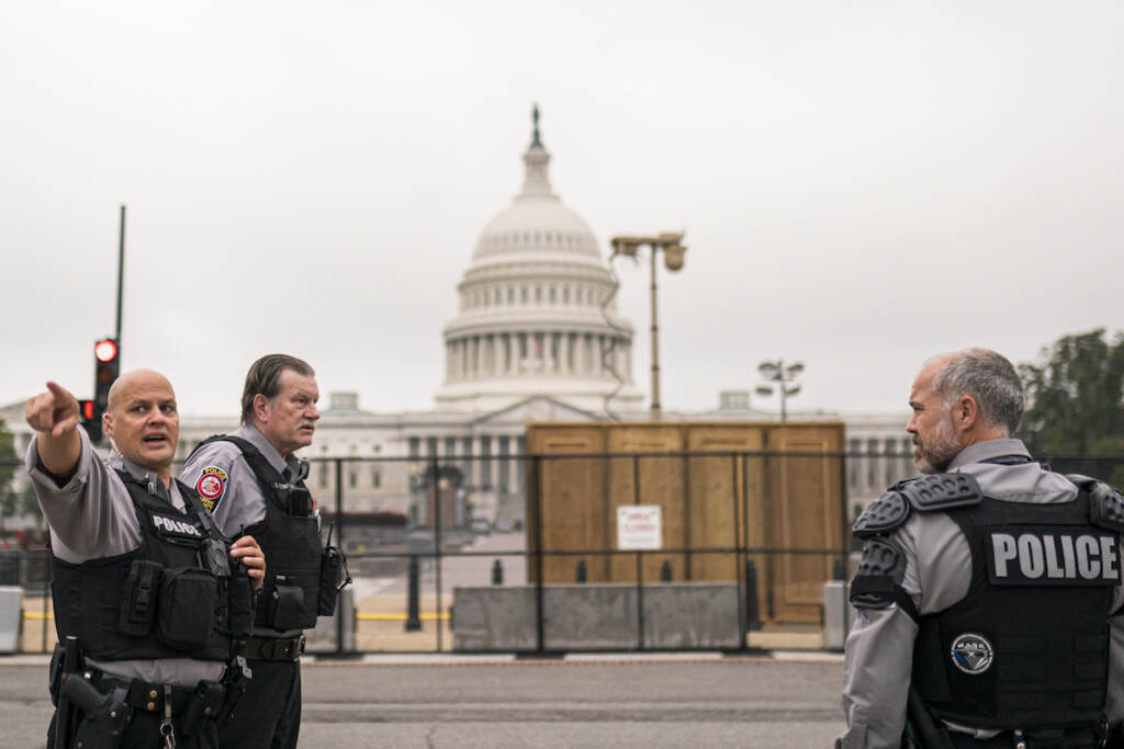 Capitol Breach Rally Police stand outside a security fence ahead of a rally near the U.S. Capitol in Washington, Saturday, Sept. 18, 2021. The rally was planned by allies of former President Donald Trump and aimed at supporting the so-called