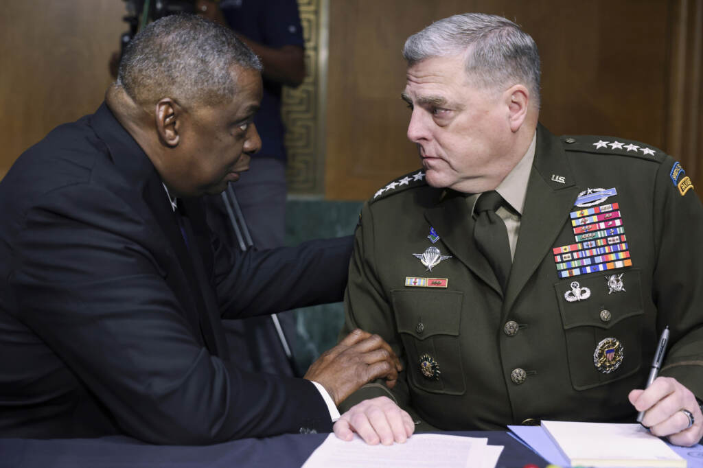 Congress Pentagon Secretary of Defense Lloyd Austin, left, and Chairman of the Joint Chiefs Chairman Gen. Mark Milley talk before a Senate Appropriations Committee hearing