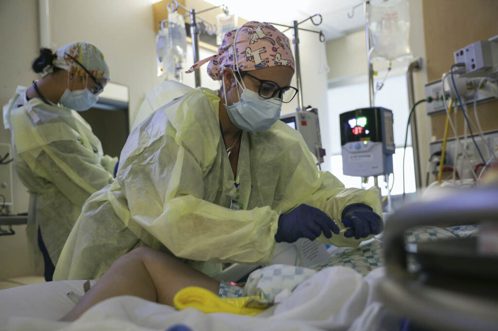 U.S. Army Medical Team Decompresses Idaho Hospital A critical care nurse administers an anti-viral medication to a COVID-positive patien