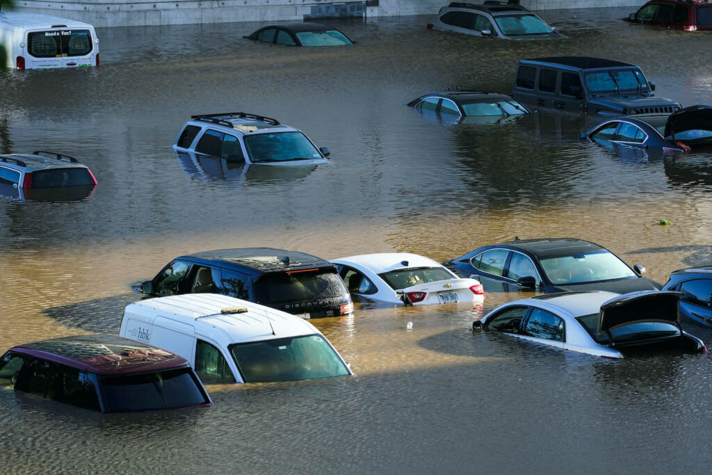 APTOPIX Tropical Weather Atlantic Vehicles are under water during flooding in a Philly parking lot