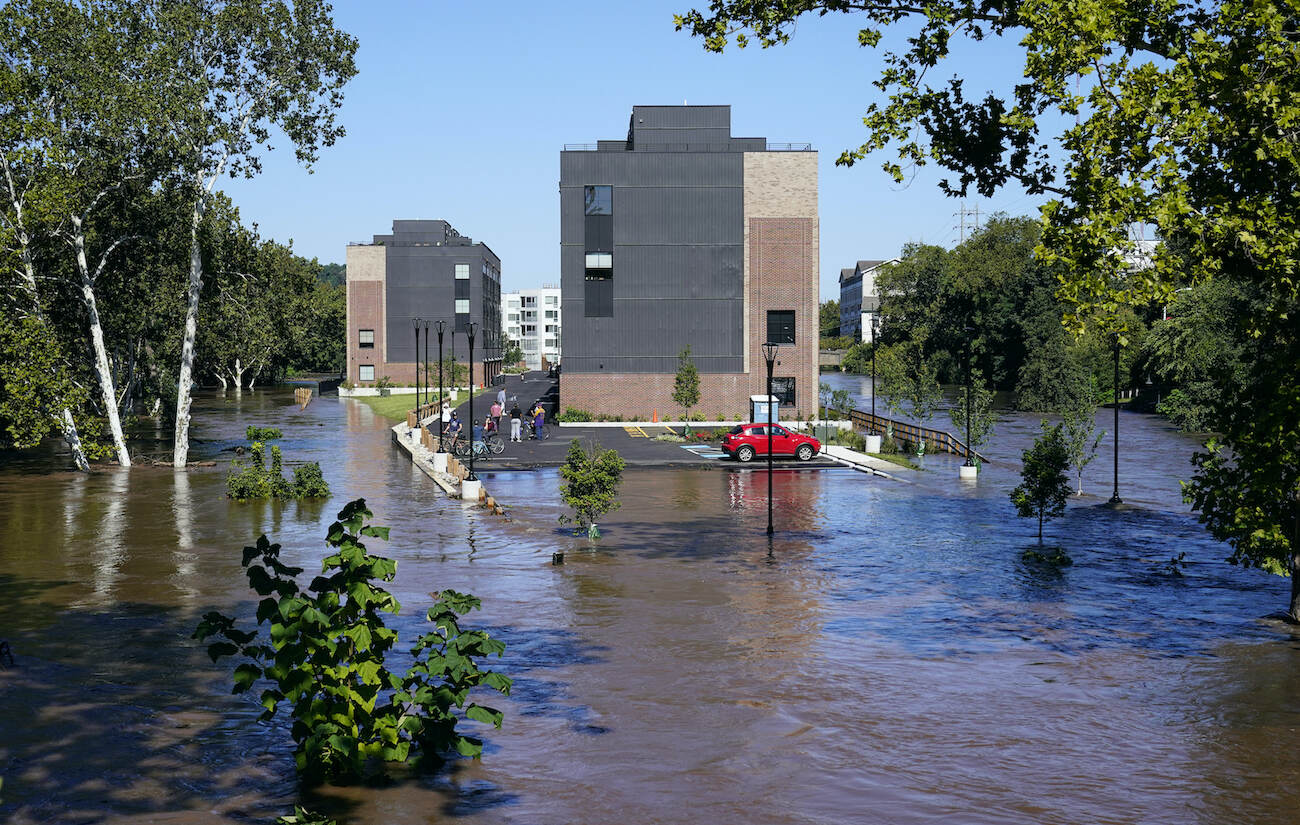 A residential building is surrounded by the floodwaters from the Schuylkill River