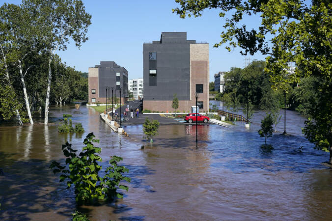 A residential building is surrounded by the floodwaters from the Schuylkill River