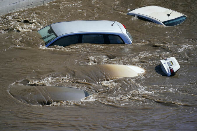 Vehicles are under floodwater from Schuylkill River