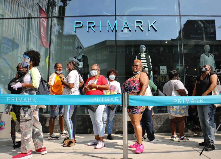 Customers line up outside the Primark store on Market Street. The line to get in to the grand opening of this latest addition to the Fashion District stretched around the block. (Emma Lee/WHYY)