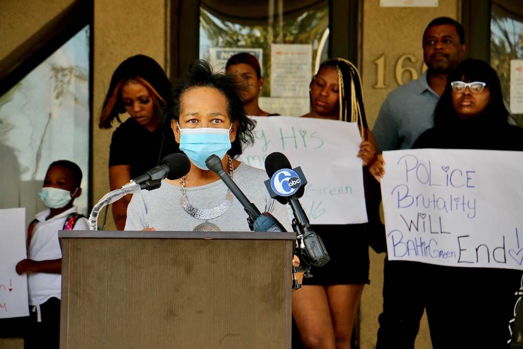 Image from iOS (192) Zulene Mayfield, wearing a mask, speaks at a press conference