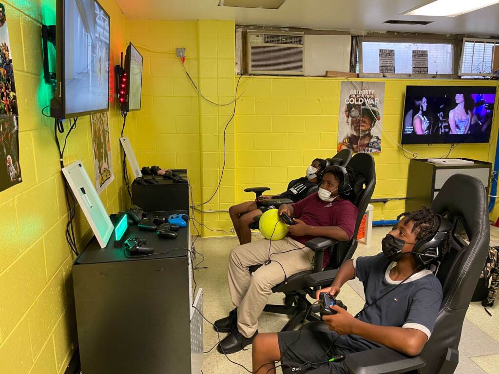 Image from iOS From left: Daniel Legg (12), Bryheem Leach (13), and Matthew Douglass (12) play in the new Christy Rec Center