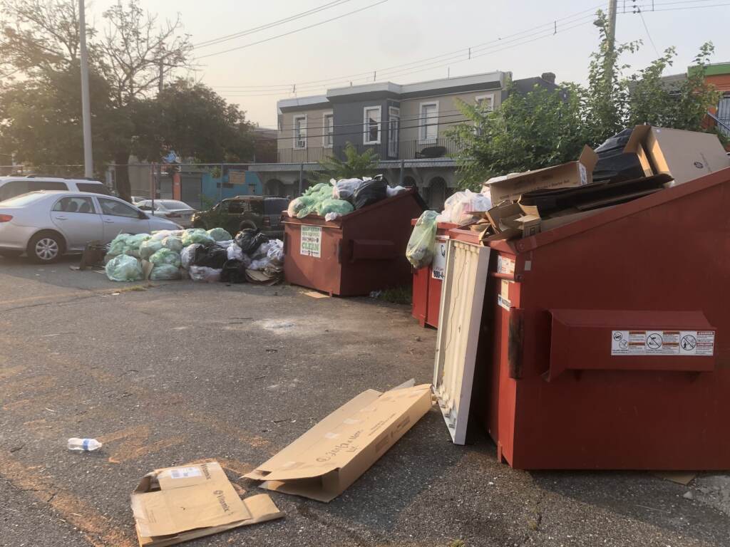 Lewis Elkin Elementary School with piles of garbage in its parking lot on Monday morning Lewis Elkin Elementary School with piles of garbage in its parking lot on Monday morning. (Emily Rizzo / WHYY)