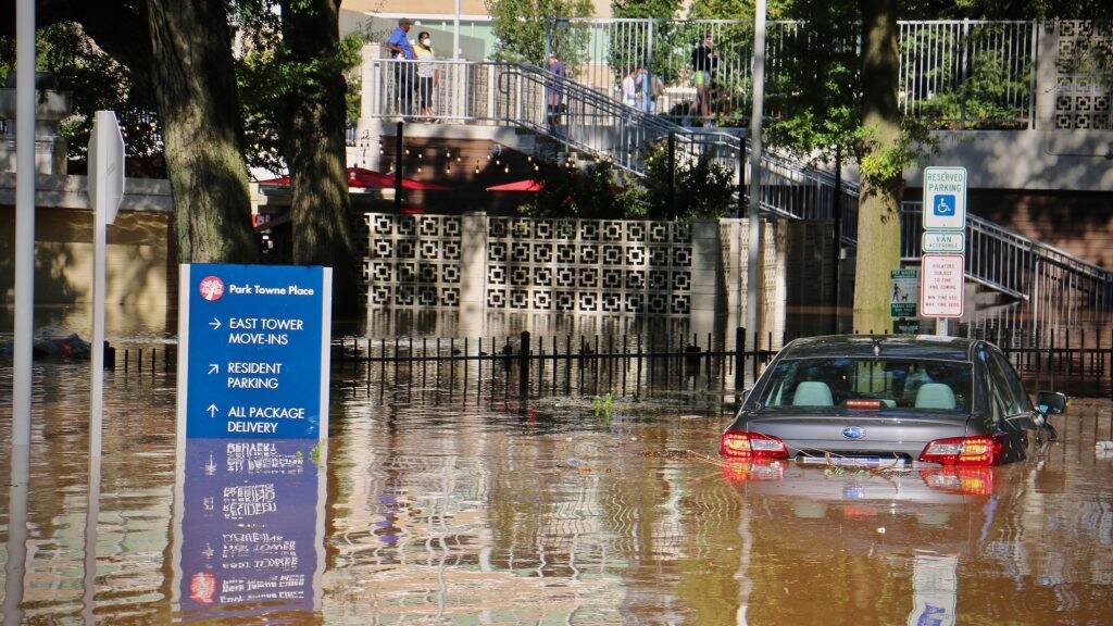 Park-Towne-Place-flooded-1024×576 A car is swamped at Park Towne Place apartments off 22nd Street near the Vine Street Expressway
