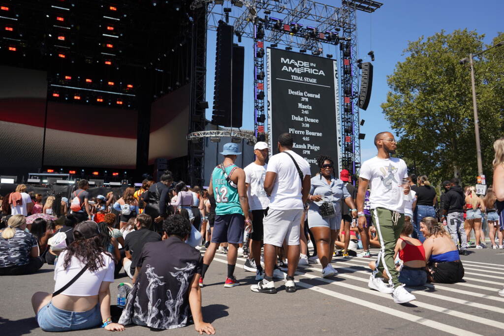 People wait in front of the Rocky Stage prior to the first set at the 2021 Made in America festival