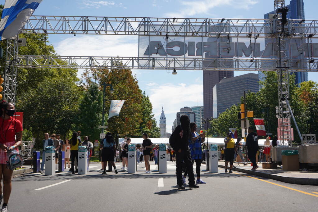 People walk through a second round of security as they enter the festival gates