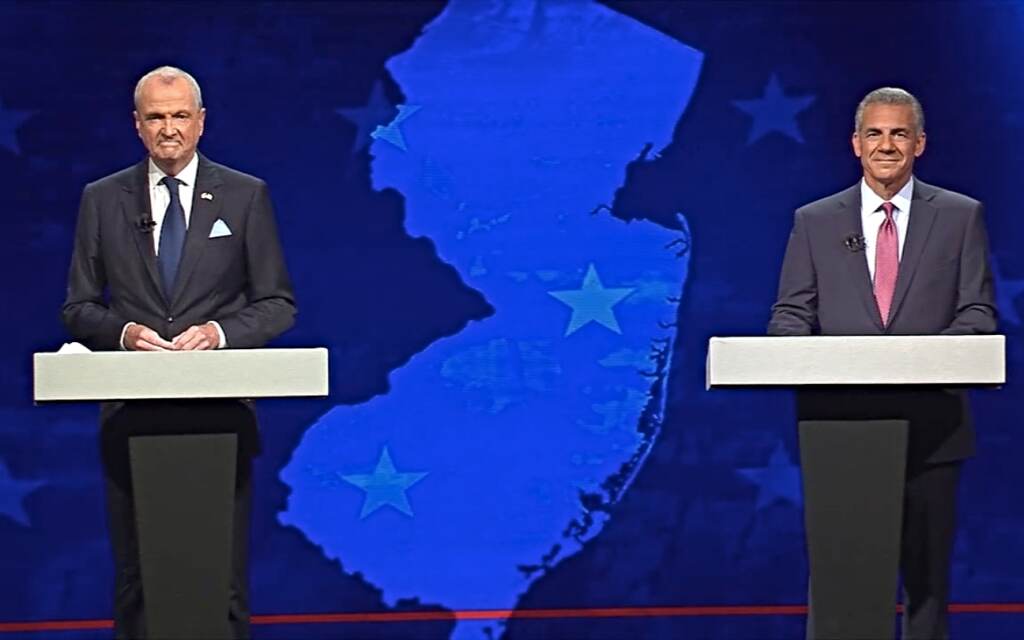 Screen Shot 2021-09-28 at 10.29.46 PM Gov. Phil Murphy (left) and ack Ciattarelli stand at podiums on opposite sides of a stage