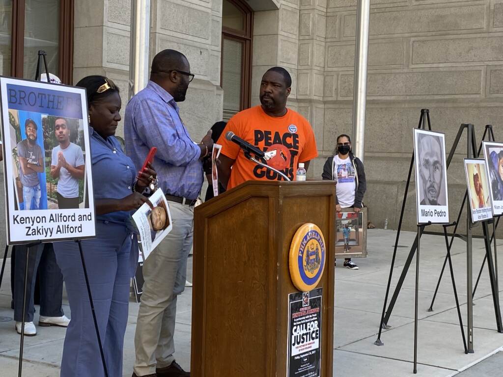 This Kimberly Kamara and her husband Kesselle. Their 23-year-old son Niam Johnson-Tate was fatally shot in July 2017. Kimberly Kamara and her husband Kesselle, pictured with Council member Kenyatta Johnson, lost their 23-year-old son Niam Johnson-Tate to gun violence in 2017. (Aaron Moselle, WHYY)
