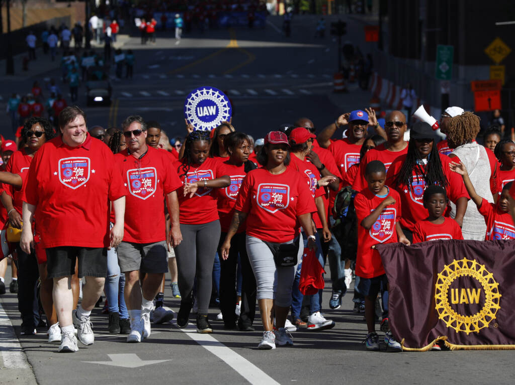 Labor Day United Auto Workers members walk in the Labor Day parade