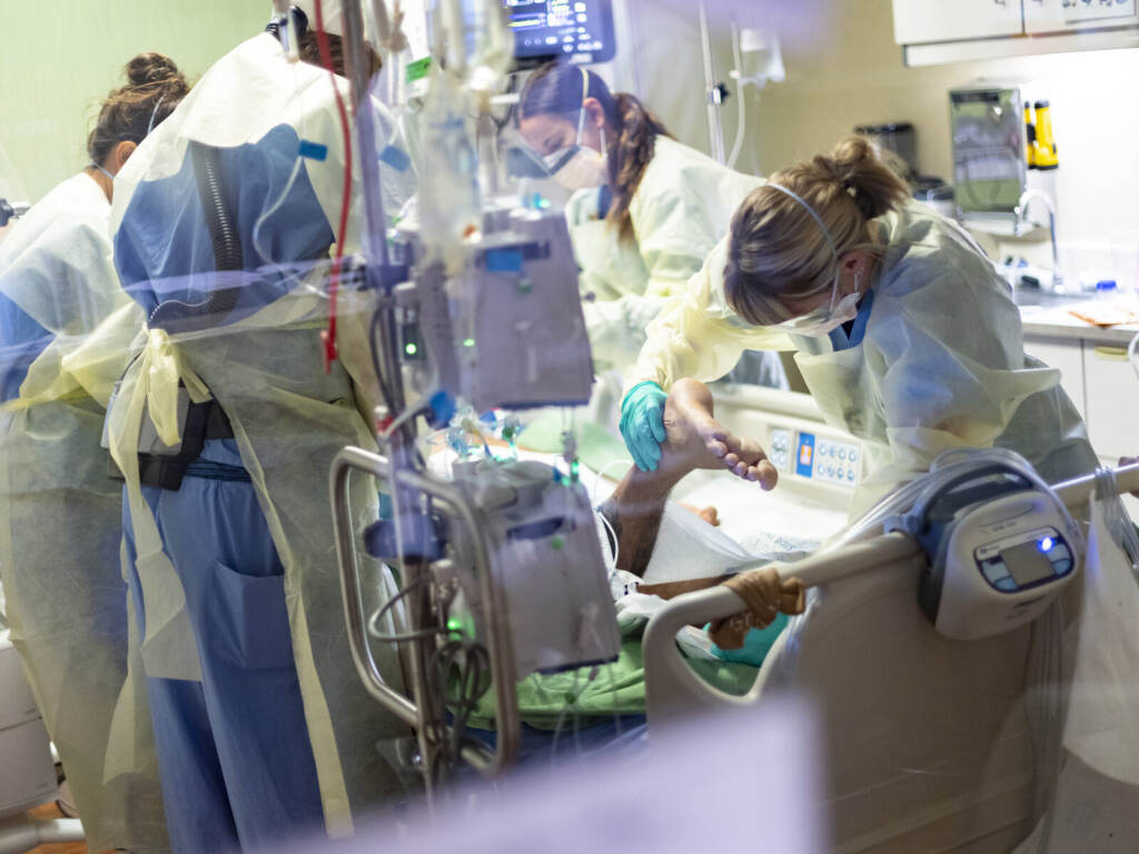 Virus Outbreak Hospital Medical professionals pronate a 39 year old unvaccinated COVID-19 patient in the Medical Intensive care unit