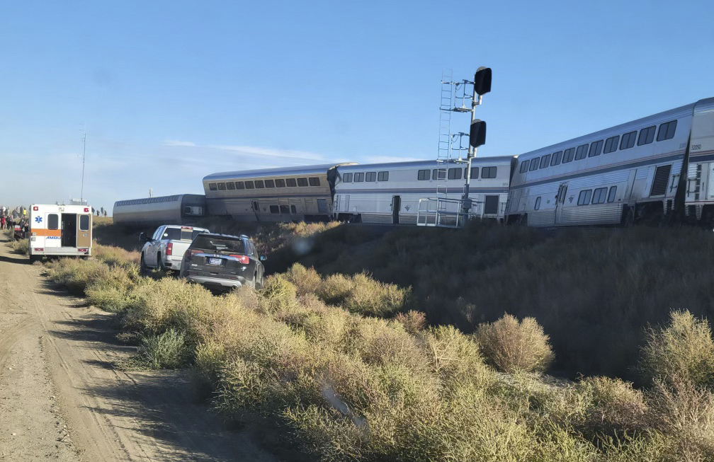 An ambulance is parked at the scene of an Amtrak train derailment on Saturday, in north-central Montana.