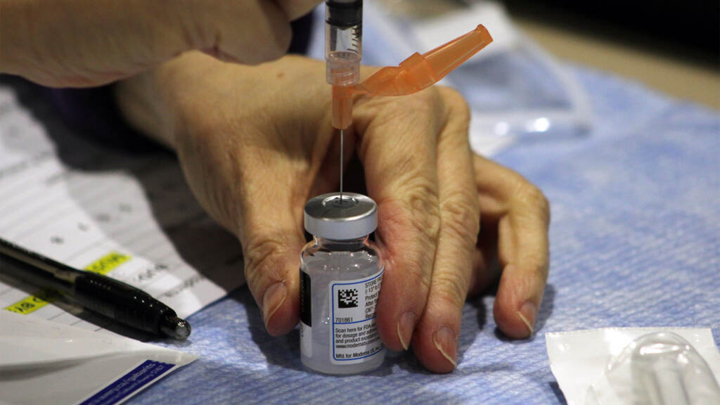 covidvaccine-vial-crop A clinician draws a dose of the Moderna COVID-19 vaccine. (FEMA)