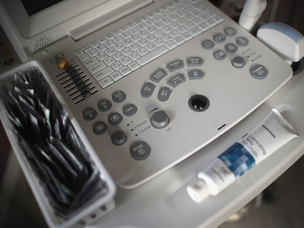 The term “fetal heartbeat,” as used in the new anti-abortion law in Texas, is misleading and not based on science, say physicians who specialize in reproductive health. What the ultrasound machine detects in an embryo at six weeks of pregnancy is actually just electrical activity from cells that aren’t yet a heart. And the sound that you “hear” is actually manufactured by the ultrasound machine. An ultrasound machine sits next to an exam table