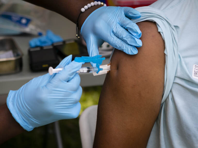 A person receives a dose of the Johnson & Johnson COVID-19 vaccine