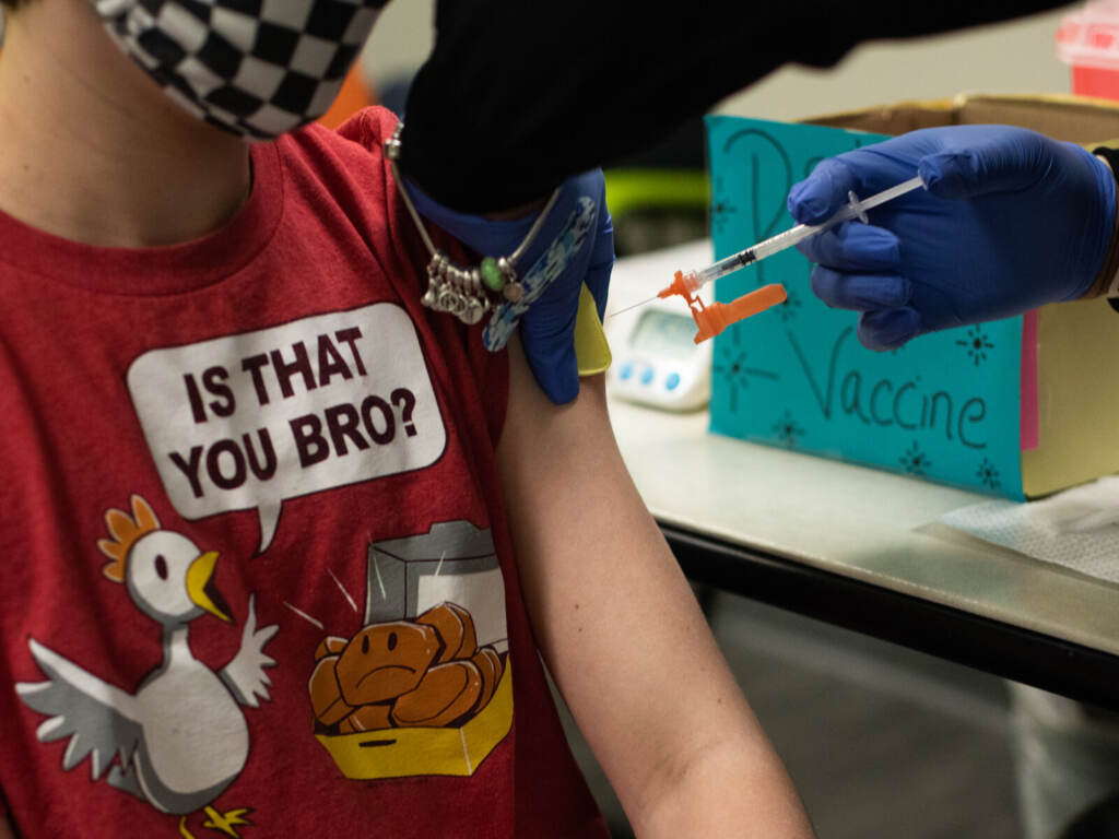 Michigan Pediatrics Office Administers Covid-19 Vaccine To Children A health care worker administers a dose of a Pfizer-BioNTech COVID-19 vaccine to a child