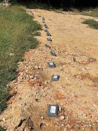 Graves of indigent people are now being dug on the site. Their names will be added to the other side of the wall. (Cris Barrish/WHYY)