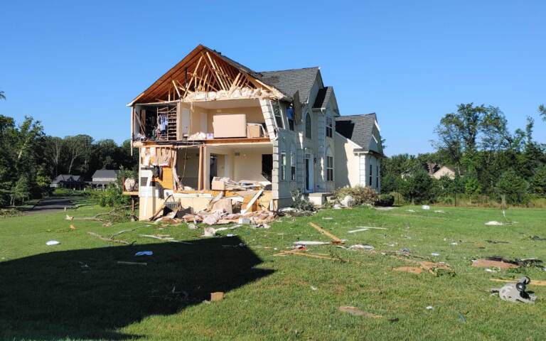 A home is seen with major damage in Mullica Hill