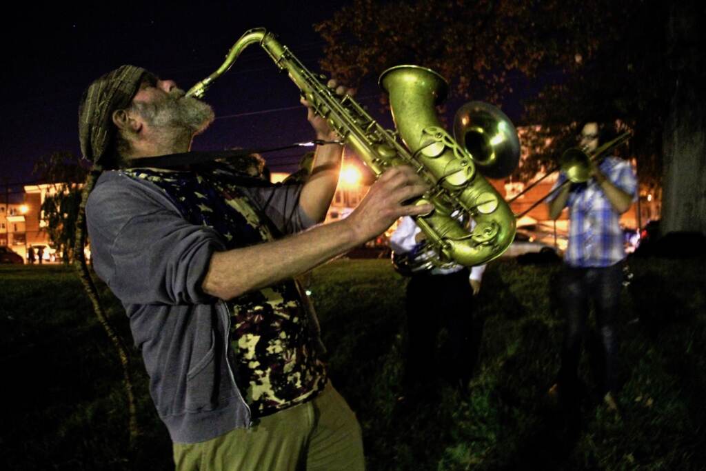 2015 10 03-e lee-elliot levin-philadelphia-west philadelphia orchestra-get out the vote Saxophonist Elliot Levin and other members of the West Philadelphia Orchestra play outside a polling place at the Salvation army building at 55th and Market streets. The orchestra (Emma Lee/WHYY)
