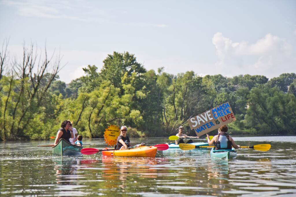 2020-8-12-k-paynter-marsh-creek-lake-8-1920×1280 Protesters of Sunoco’s Mariner East Pipline kayaked to a clean-up site on Marsh Creek Lake in Chester County, Pa., where the DEP says 8,000 gallons of drilling mud migrated into the stream. (Kimberly Paynter / WHYY)