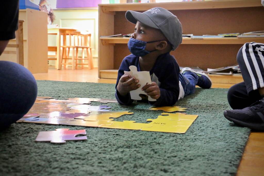 2021 10 01-e lee-gabriel watson-philadelphia childrens playhouse whitman-child care worker shortage Gabriel Watson, 3, works on a puzzle during his preschool class at Children's Playhouse Whitman in South Philadelphia. (Emma Lee/WHYY)