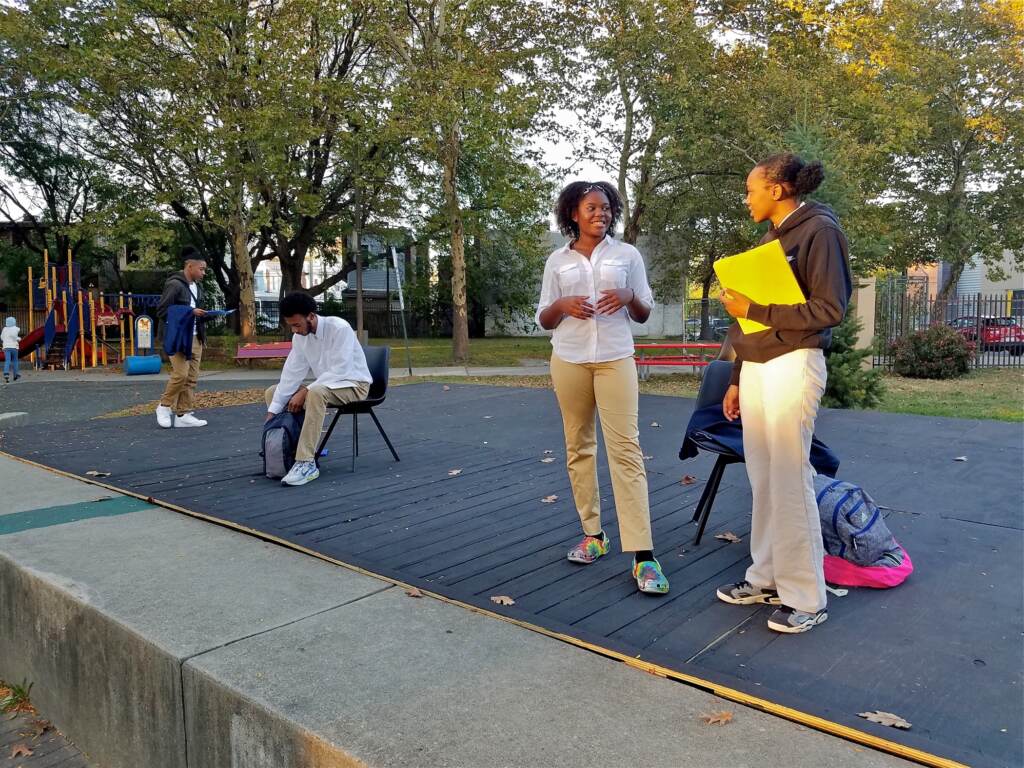 2021 10 20-p crimmins-jamall phillips carmi jackson eva vanterpool azzari myers-camden nj-environmental racism play Cast members (from right) Azzari Myers, Eva Vanterpool, Carmi Jackson, and Jamall Phillips rehearse ''Town Hall: Resolution 50'' in Camden’s Northgate Park. The play about environmental racism in Camden will be performed this Saturday, in the park
