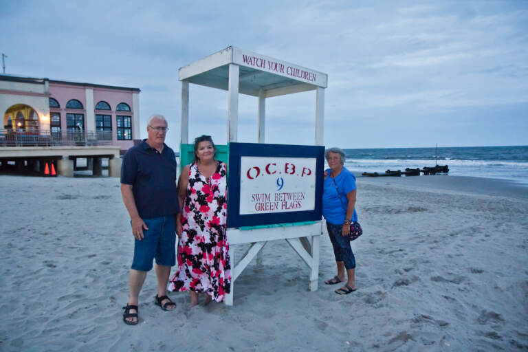 Mark Hornick (left), Suzanne Hornick (center) and Susan Cox (right) on the Ocean City, N.J. beach in August 2021. (Kimberly Paynter/WHYY)