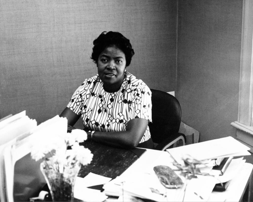 Dorothy Bolden working at her desk at the NDWUA offices in Atlanta