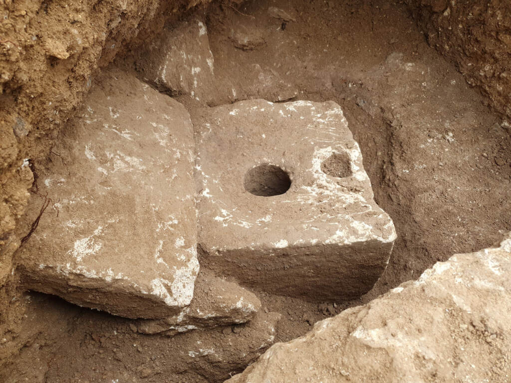 Israel Ancient Toilet In this photo provided by Israel Antiquities Authority shows a rare ancient toilet in Jerusalem dating back more than 2,700 years Jerusalem, Tuesday, Oct. 5, 2021. The Israeli Antiquities Authority said on Tuesday that the smooth, carved limestone toilet was found in a rectangular cabin that was part of a sprawling mansion overlooking what is now the Old City. ( Yoli Schwartz/ Israel Antiquities Authority via AP)