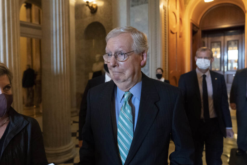 Mitch McConnell Senate Minority Leader Mitch McConnell of Ky., walks to a policy luncheon on Capitol Hill, Thursday, Oct. 7, 2021, in Washington