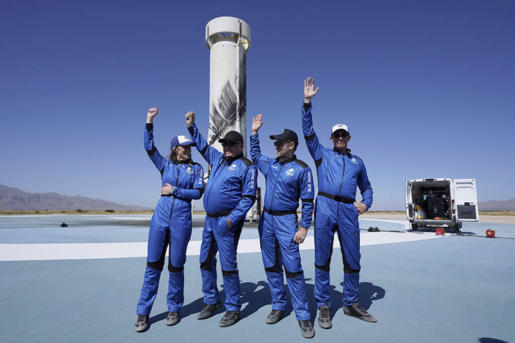 Chris Boshuizen, William Shatner, Audrey Powers, Glen de Vries Blue Origin's New Shepard rocket latest space passengers from left, Audrey Powers, William Shatner, Chris Boshuizen, and Glen de Vries raise their hands during a media availability at the spaceport near Van Horn, Texas, Wednesday, Oct. 13, 2021