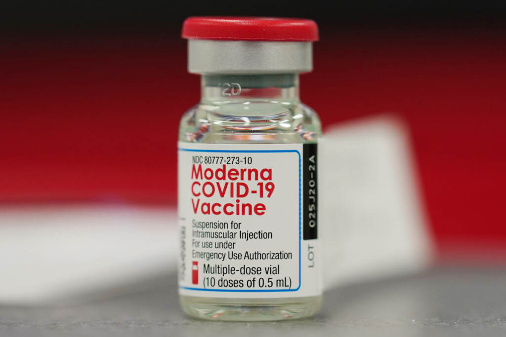 Moderna vaccine vial A vial of the COVID-19 vaccine from Moderna sits on a table top to be used in vaccinating employees in the first round of staff vaccinations at Rose Medical Center Wednesday, Dec. 23, 2020, in Denver