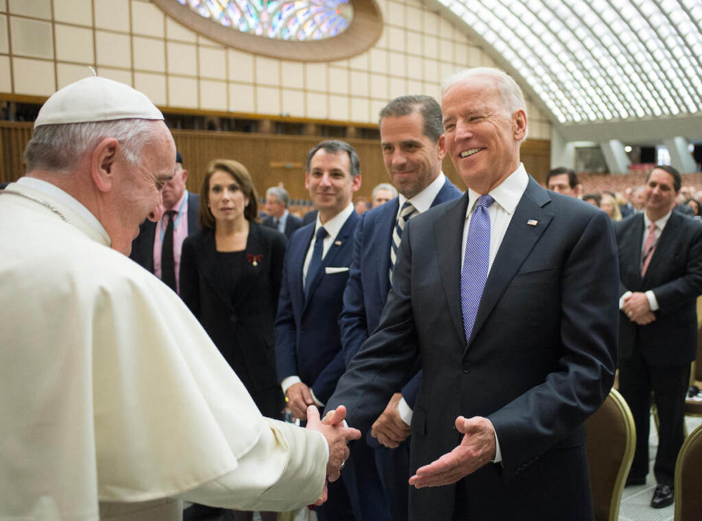 In this April 29, 2016, file photo, Pope Francis shakes hands with Vice President Joe Biden as he takes part at a congress on the progress of regenerative medicine and its cultural impact, being held in the Pope Paul VI hall at the Vatican
