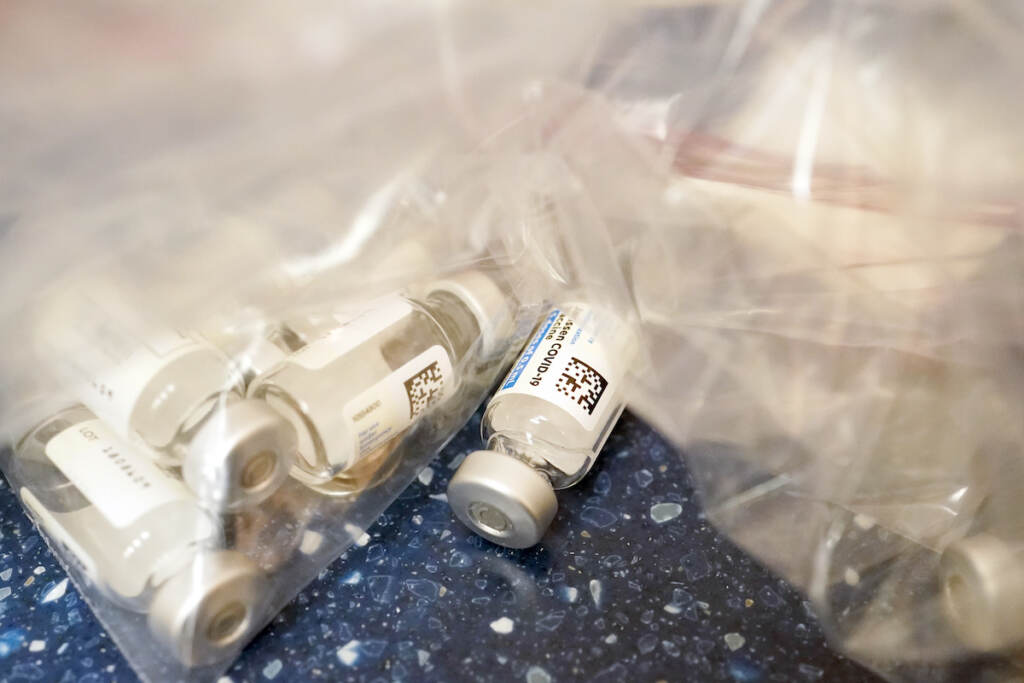 Empty vials of the Johnson & Johnson's one-dose COVID-19 vaccine are seen at the Vaxmobile, at the Uniondale Hempstead Senior Center, Wednesday, March 31, 2021, in Uniondale, N.Y.