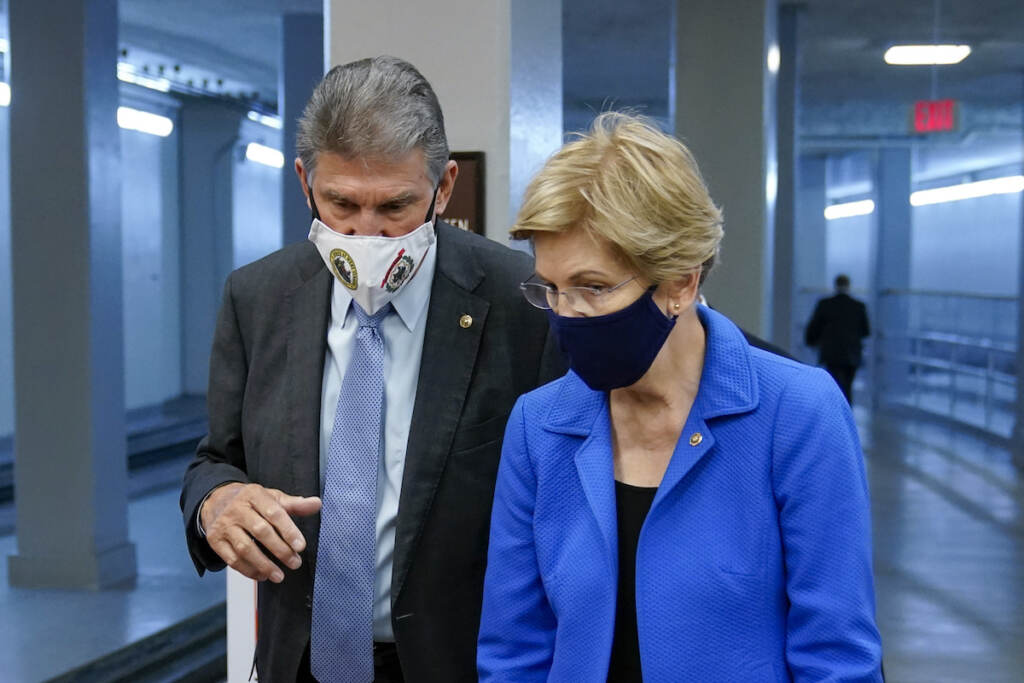 Joe Manchin, Elizabeth Warren Sen. Joe Manchin, D-W.Va., left, speaks with Sen. Elizabeth Warren, D-Mass., on Capitol Hill in Washington, Wednesday, Oct. 27, 2021
