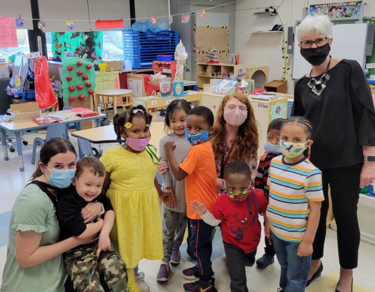 Susan Bunting (right) visits the classroom of 2020 Delaware Teacher of the Year Rebecca Vitelli (third from right)