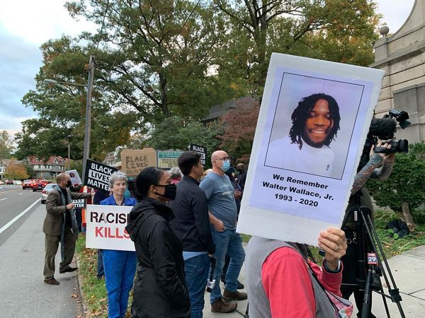 members of the public gathered for a vigil for Walter Wallace Jr. at the Germantown Unitarian Society in Philadelphia